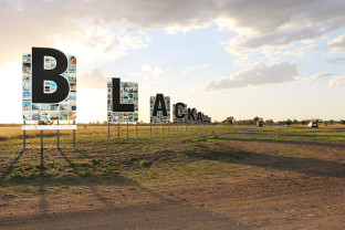 blackall-sign-with-bike-riders.jpg