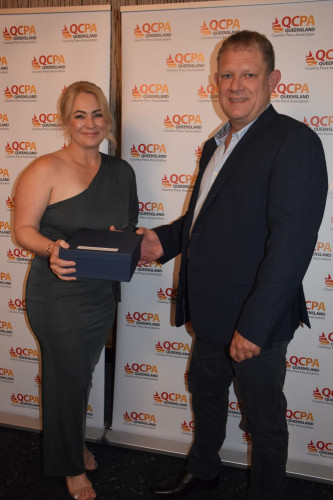 Rebecca Douthwaite, Mackay & Whitsunday Life accepts trophy from Gavin Hartslief, ECO3